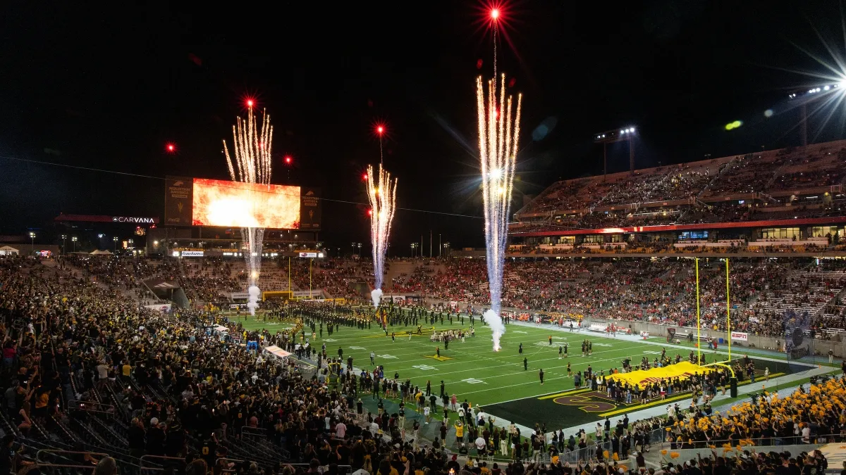 Fireworks shooting off from ASU's football field during a full game at night