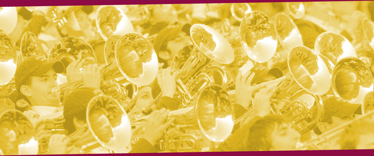 An image of athletic band trumpeters