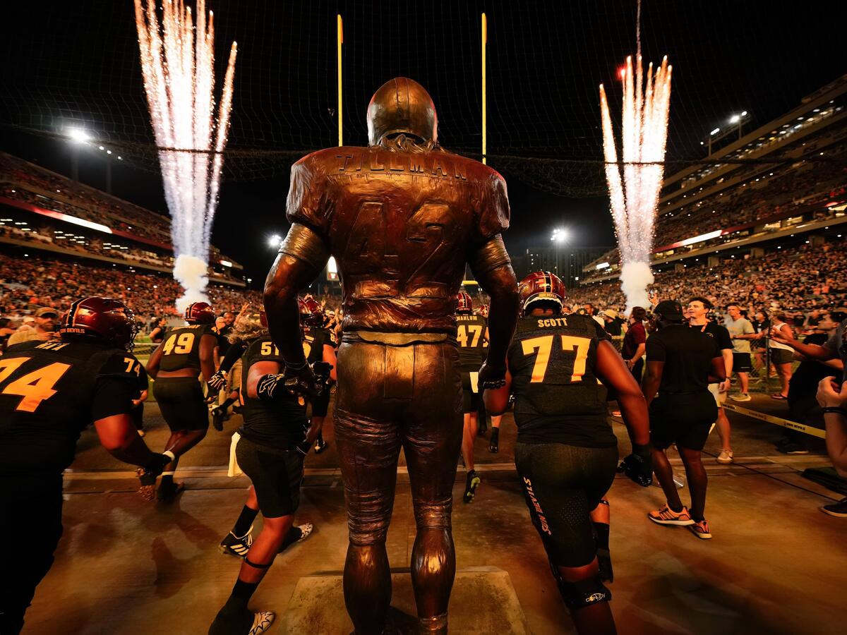 Sun Devil Football running out of tunnel for Salute to Service game with Pat Tillman statue